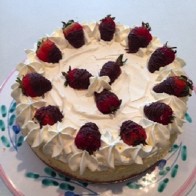 Cheesecake with a Graham Cracker Crust, topped with Chocolate Dipped Strawberries Cheesecake with a Graham Cracker Crust, topped with Chocolate Dipped Strawberries